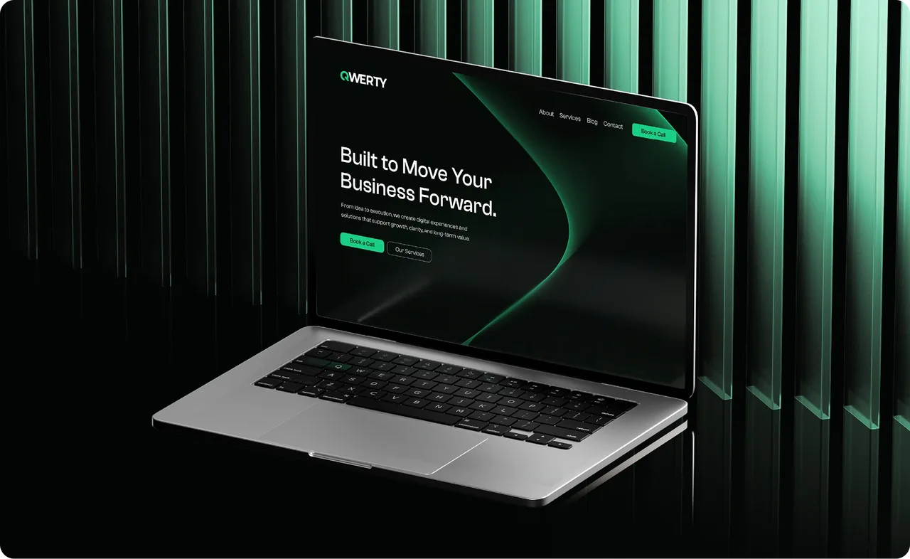 QWERTY website on a laptop against green light