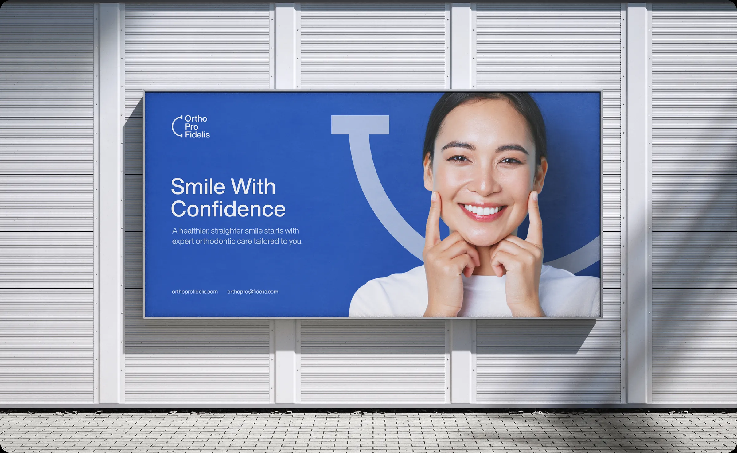 An Ortho Pro Fidelis billboard reading “Smile With Confidence”