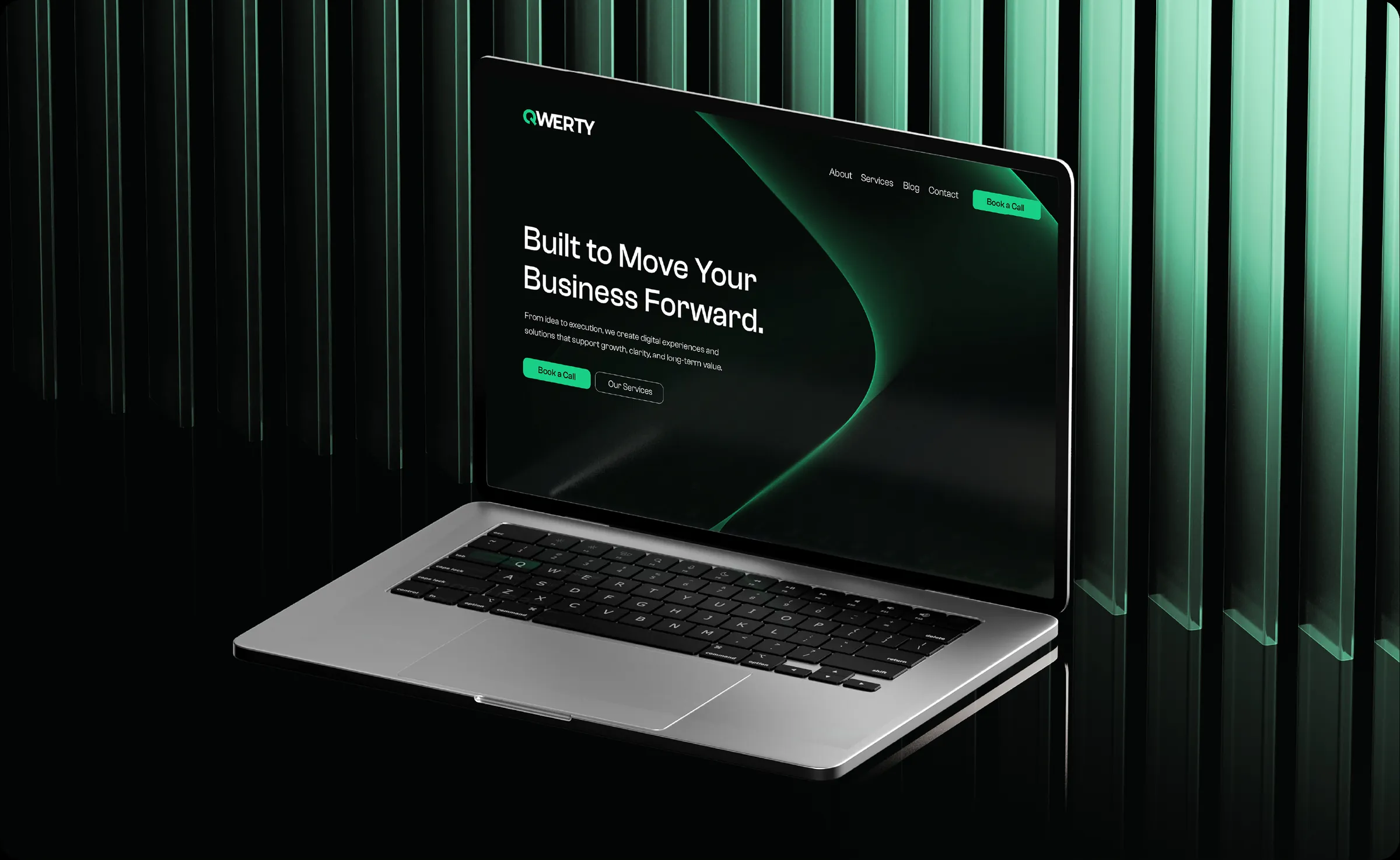 The QWERTY homepage open on a laptop against a backlit green backdrop