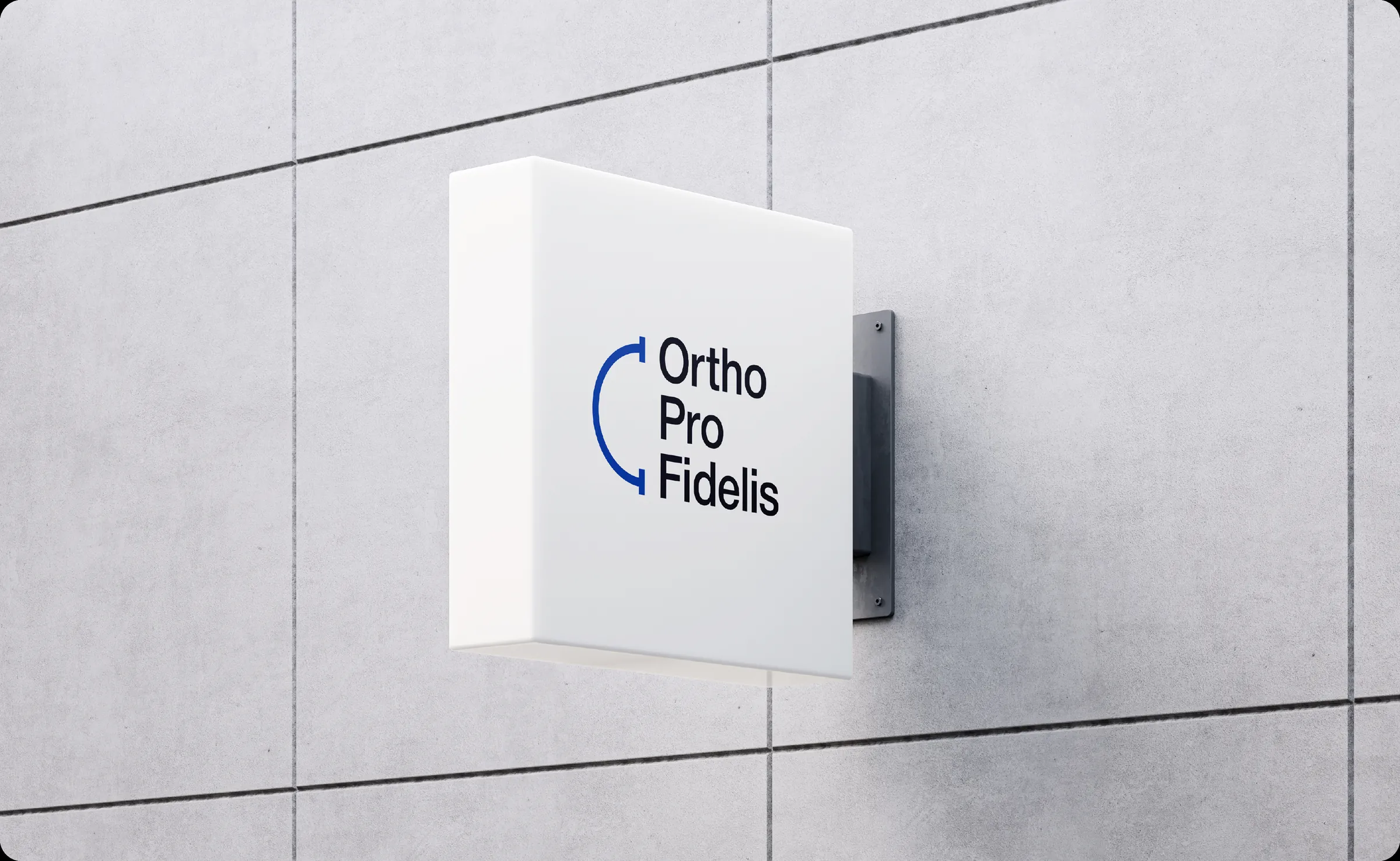 The Ortho Pro Fidelis projecting sign mounted on a concrete wall