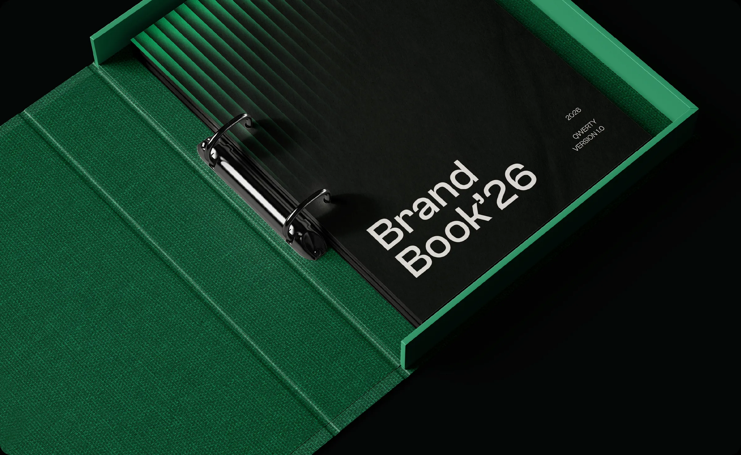 The QWERTY brand book in a green ring binder and slipcase